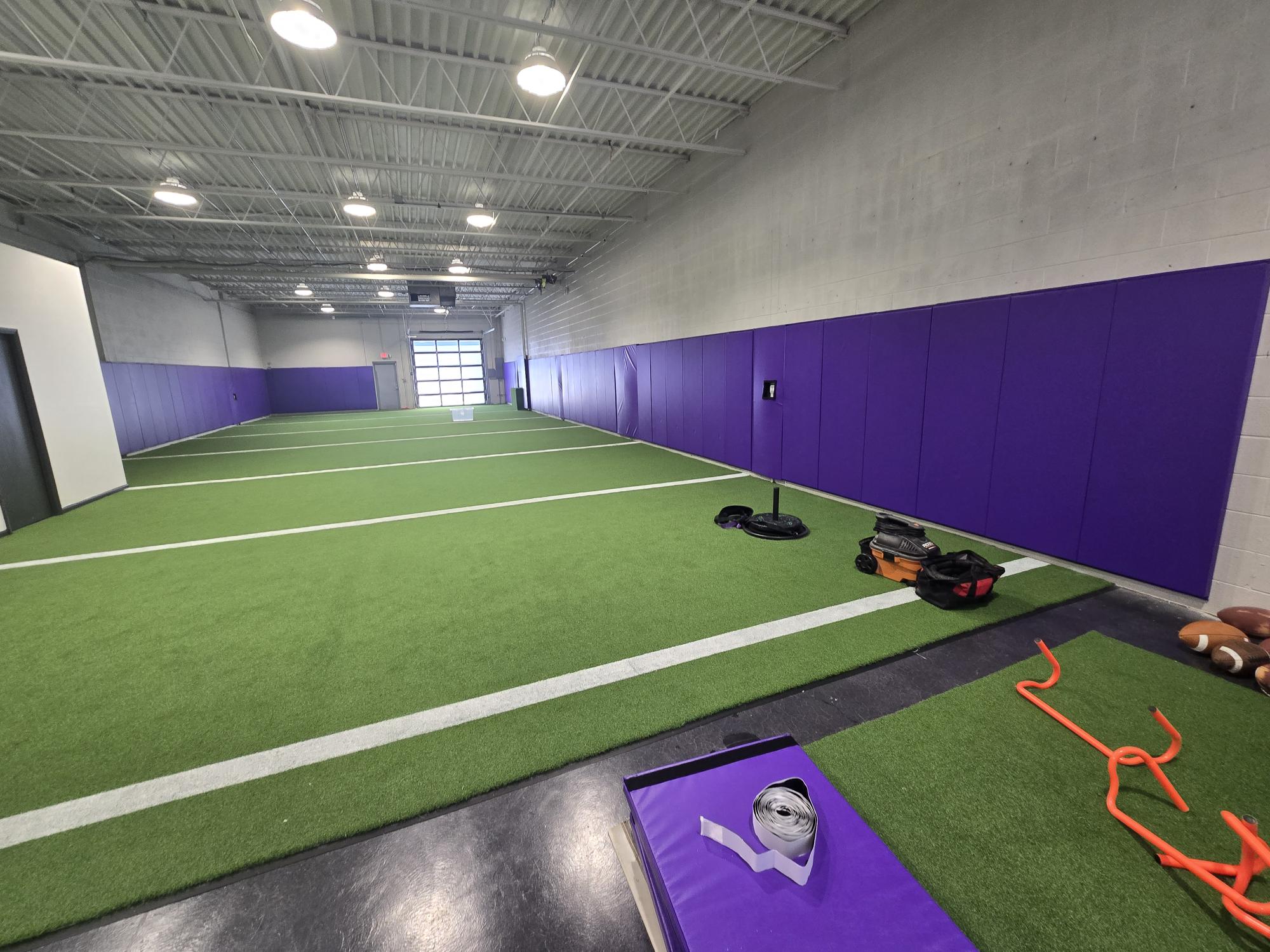 Purple wall pads long view indoor facility